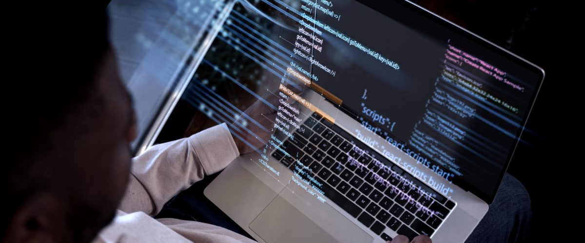 programming-background-with-person-working-with-codes-computer